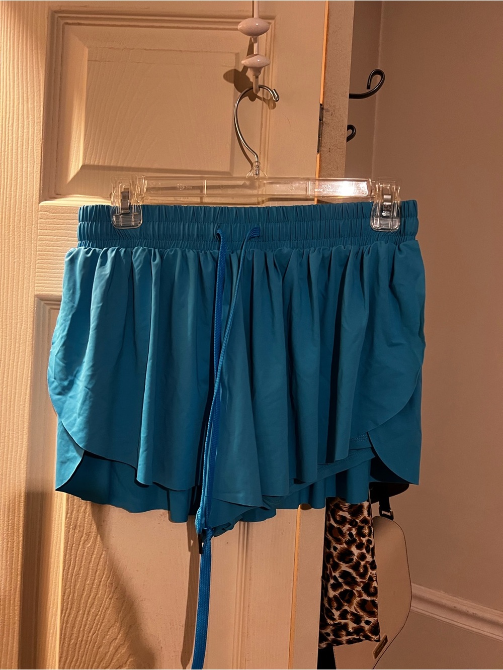 Women’s Teal Ruffle Active Shorts. GB Size Medium, Spandex underneath